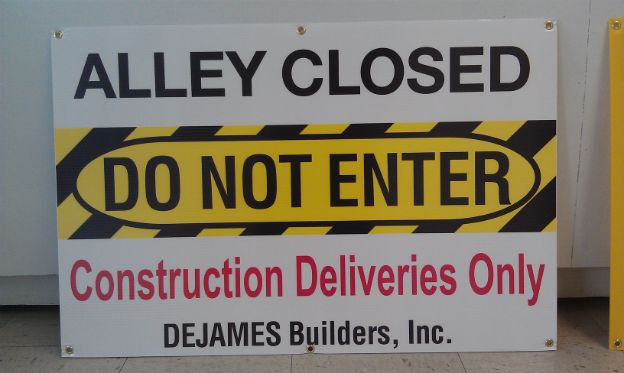 DeJames Construction Inc.  Informational temporary Cor-x construction signs with brass grommets for hanging on fence.